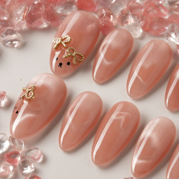 Thump Bunny medium oval press-on nails with peach heart cat-eye and bunny feature