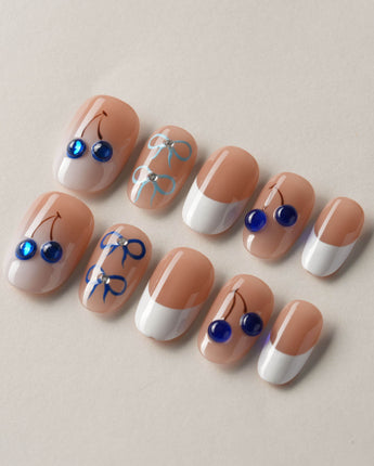 Klein Blue Cherry salon-style press-ons with glossy white and blue cherry nail art