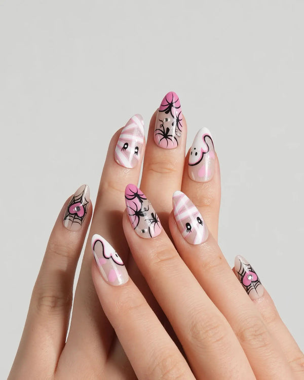 Cute pink Halloween nails with ghost and web design