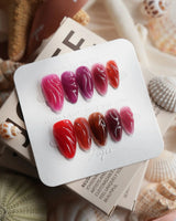 Berry Jelly sculptural press-on nails in translucent raspberry, blackberry, and wine tones