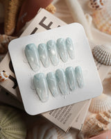 Still Water sheer mint green jelly nails with 3D water droplets and gel swirls