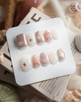 Pink Treasure marble shell press-on nails with rose, cream and silver accents