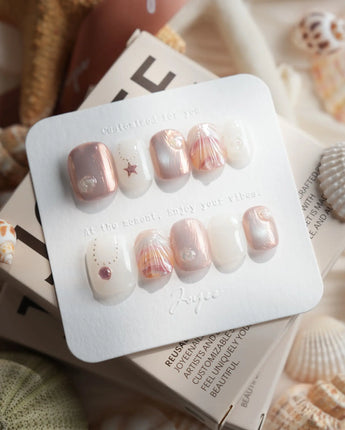 Pink Treasure marble shell press-on nails with rose, cream and silver accents
