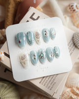 Ocean Heart handmade ocean-inspired nails with teal chrome and coral branch details