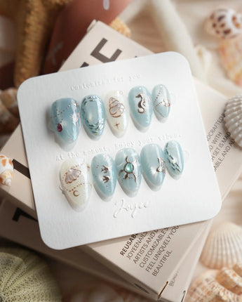 Ocean Heart handmade ocean-inspired nails with teal chrome and coral branch details