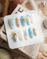 Shell Picking shell and starfish press-on nails with wet ocean-washed shine