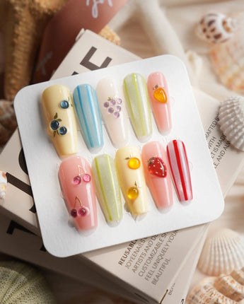 Fruit Fizz close-up of chrome fruit nail art with glossy pastel bases