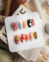 Kusama Dot pop-art press-on nails with bold polka dots, 3D bow and pumpkin motif