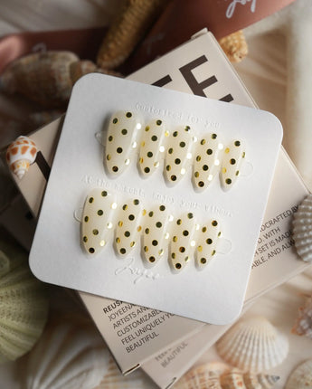 Golden Dot metallic gold dot nails with mirror-like circles on a glossy nude base