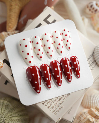 Creamy Cherry press-on nails with red and white polka dots with creamy cherry styling