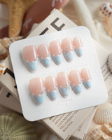 Oyster Blue refined press-on nails with starfish chain charm, pearls, and baby-blue tips