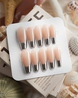 Silver Sleek silver chrome French nails photographed with high-shine reflective tips
