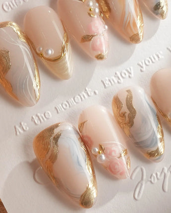 Vintage Mist press-on nails with tender marble, gold foil edges and pearl accents