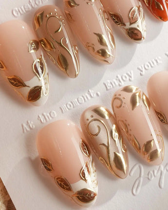 Falling leaves press-on nails with caramel autumn tones, 3D gold leaves and vine details