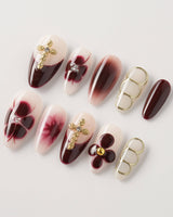 Tip Burgundy Nails press-ons showing milky white nails, red tips, and ornate gold accents