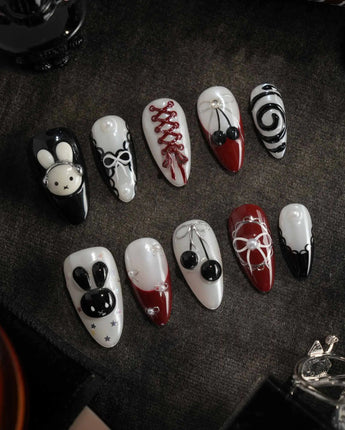 Dark Miffy handmade press-on nails featuring black white red mix design bunny lace bow cherry swirl french 3D accents