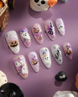 Hallow’s Eve handmade press-on nails featuring sheer pink base iridescent glitter ghost pumpkin 3D accents rhinestone mix