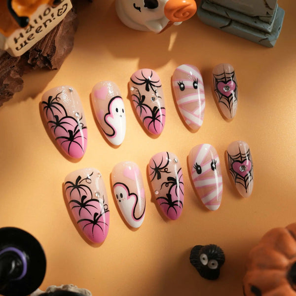 Halloween pink ghost nails with spider web accents