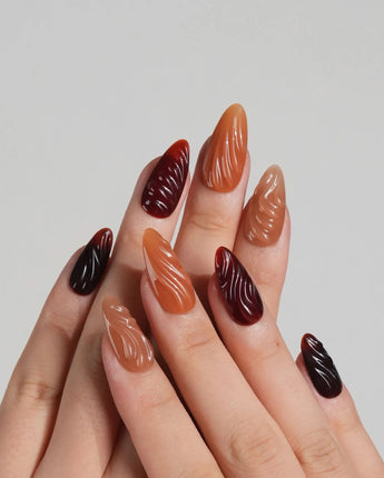 The Whole Fall nail set with warm amber tones, caramel gradient, and glossy ripple texture