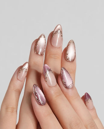 Caramel Petal press-on nails with mauve rose chrome French tips and gold baroque linework