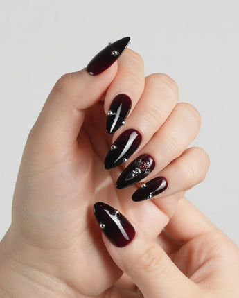 The Curse press-on nails — red to black gradient glossy chrome studs gothic cross charm handmade nail art by Joyee Nails