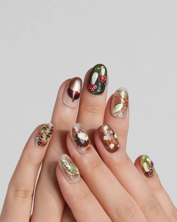 Handmade woodland press on nails with hedgehog, acorn, and leaf elements