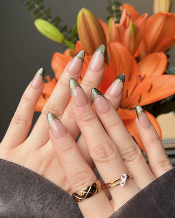 Silk Green nail design with dark green cat-eye effect, nude base, and glossy gel finish