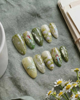 Emerald Wild nail art close-up showing Mori Monet's Garden, Hand-painted Forest Fairies & 3D Water Droplets. details