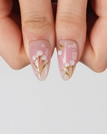 Coquette Garden handmade press-on nails featuring Gentle Pink Gradient, 3D White Bows & Hand-painted Tulips.