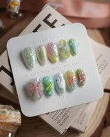 Seaglass Swan city-summer nails with tidal shimmer and pastel sculpted details