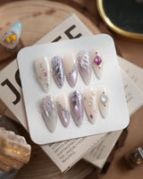 The Cygnus press-on nails — silver lilac cat eye feather chrome rhinestone cat eye effect handmade nail art by Joyee Nails