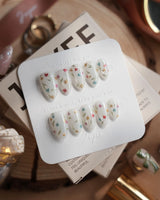 Wildflower handmade press-on nails featuring Fresh Creamy White, Colorful Metallic Dainty Florals & Gold Wire Stems.