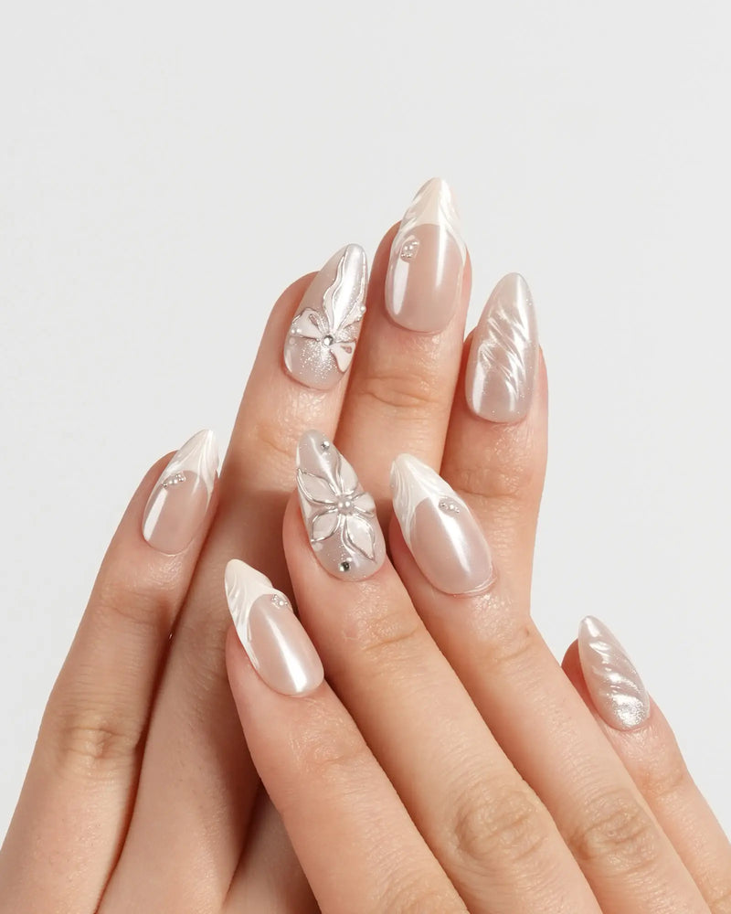 Nude 3D press-on nails with sculpted floral ribbon embossed accents — Satin Dress by Joyee Nails