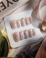 Snowfall press-on nails — pearl nude cat eye snowflake bow silver glitter soft sheen handmade nail art by Joyee Nails