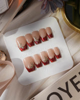 Bow French press-on nails — nude base red chrome french gold outline bow accent handmade nail art by Joyee Nails