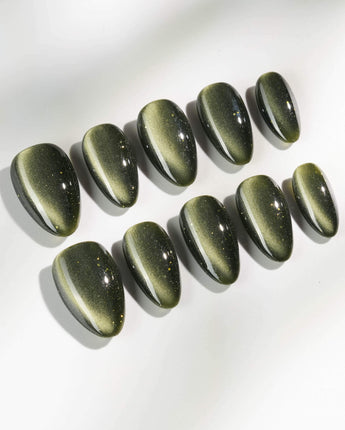 Alga press-on nails in extra short almond shape — Deep Dark Green, Cat Eye Glossy Effect.