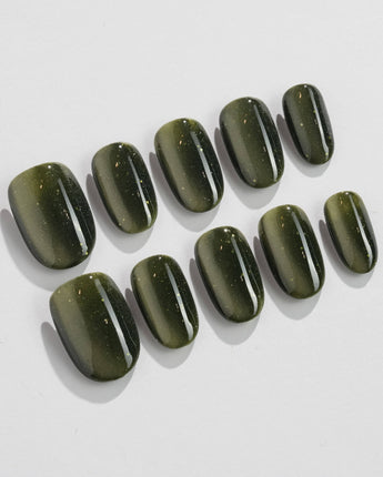 Alga press-on nails in short oval shape — Deep Dark Green, Cat Eye Glossy Effect.