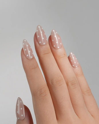 Cloud Cream nail art close-up showing Peach Nude, Sweet White Polka Dots. details