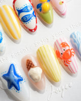Amalfi Day vacation nail art with blue wave stripes and red cabana patterns