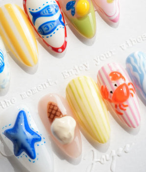 Amalfi Day vacation nail art with blue wave stripes and red cabana patterns