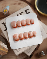 Amber Maple press-on nails in extra short coffin shape — orange french tips gold outline maple leaves