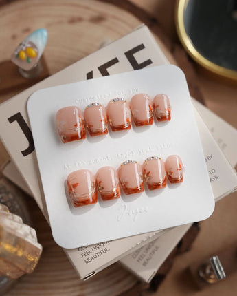 Amber Maple extra short coffin press-on nails with orange tips and gold maple leaves