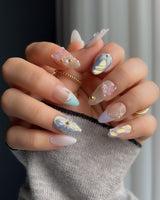Aqua Petal short almond press-ons with soft blue pastels and raised flower art