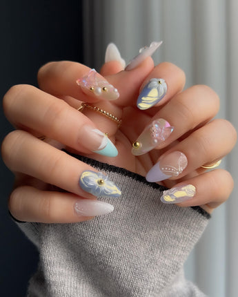 Aqua Petal short almond press-ons with soft blue pastels and raised flower art