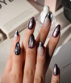 Arcana press on nails with sculpted silver sun, moon, star and key charms and a silver wing on plum and black cat eye with crystals - image 2