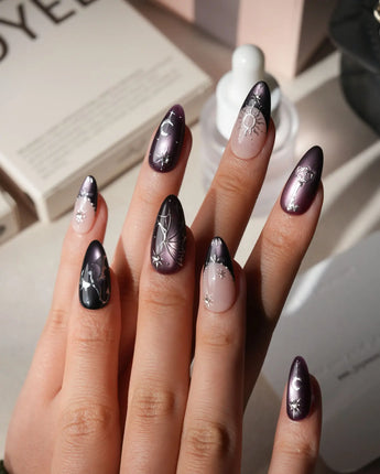 Arcana press on nails with sculpted silver sun, moon, star and key charms and a silver wing on plum and black cat eye with crystals - image 2