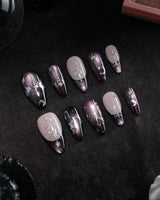 Arcana press on nails with sculpted silver sun, moon, star and key charms and a silver wing on plum and black cat eye with crystals - image 3