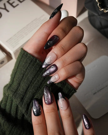 Arcana press on nails with sculpted silver sun, moon, star and key charms and a silver wing on plum and black cat eye with crystals - image 5