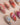 Artistic red marble press-on nails with gold frame