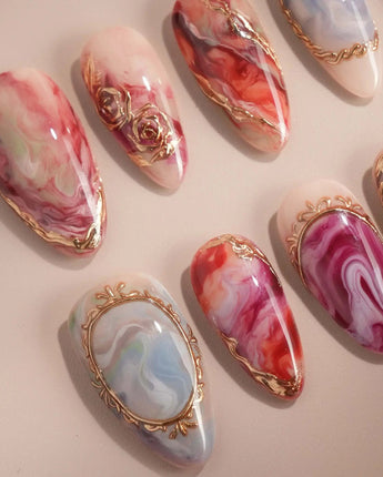 Baroque Palette handmade press-on nails featuring marble mix design pink red blue swirl gold outline rose accents glossy